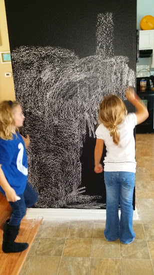 girls chalking wall